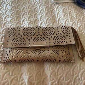 Taupe colored clutch that can be also a crossbody. Purchased in Greece.